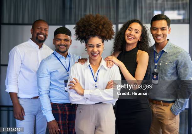happy, professional and corporate business people standing with arms crossed in an office together at work. portrait of a manager leading a team and smiling with arms folded while standing in line - person with arms crossed stock pictures, royalty-free photos & images
