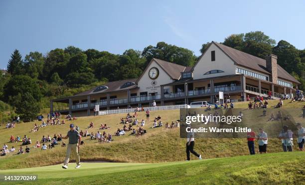 Julien Guerrier of France acknowledges the crowd on the 18th green during the third round of the Cazoo Open at Celtic Manor Resort on August 06, 2022...