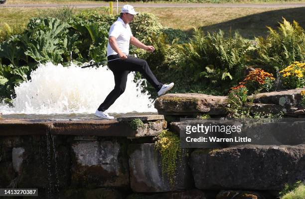 Callum Shinkwin of England crosses the bridge to the 18th green during the third round of the Cazoo Open at Celtic Manor Resort on August 06, 2022 in...