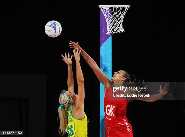 Gretel Bueta of Team Australia and Geva Mentor of Team England compete for the ball during the Netball Semi-Final match between Team England and Team...