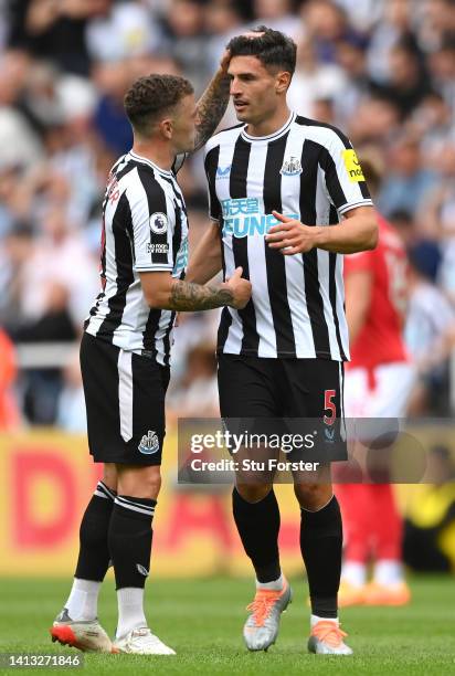 Fabian Schar of Newcastle United celebrates scoring their side's first goal with teammate Kieran Trippier during the Premier League match between...