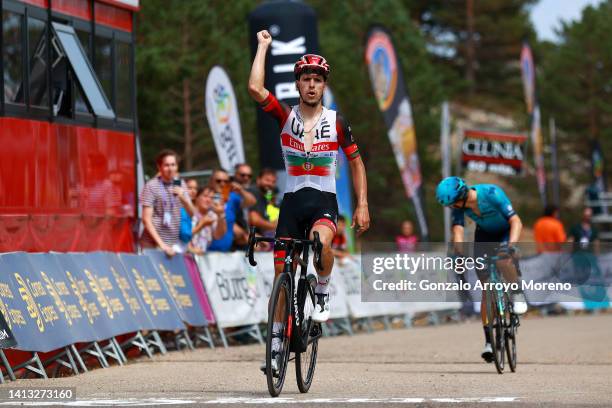 Joao Almeida of Portugal and UAE Team Emirates celebrates winning ahead of Miguel Ángel López Moreno of Colombia and Team Astana – Qazaqstan during...