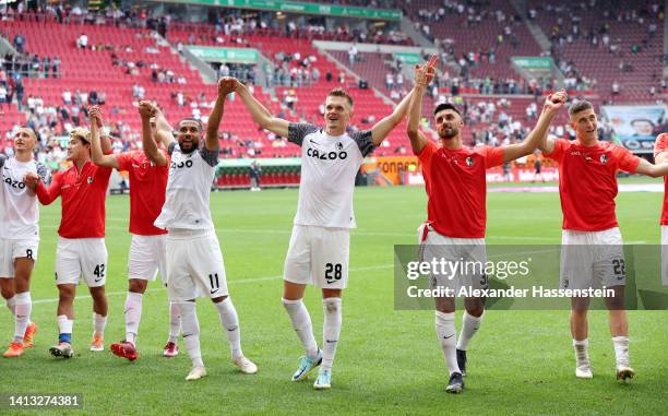 Players of SC Freiburg celebrate after the final whistle of the Bundesliga match between FC Augsburg and Sport-Club Freiburg at WWK-Arena on August...