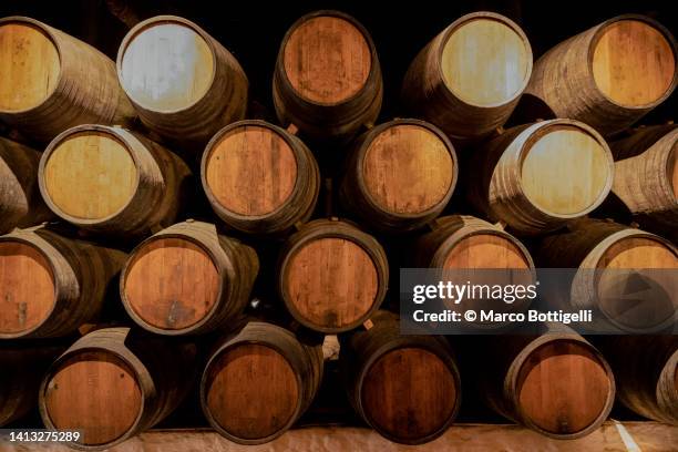 barrels in a wine cellar - portwein stock-fotos und bilder