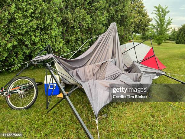 collapsed tent after a storm - damages compensation stock-fotos und bilder