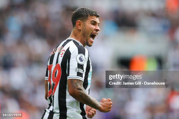 Bruno Guimaraes of Newcastle United celebrates after Fabian Schar scores his side's first goal during the Premier League match between Newcastle...