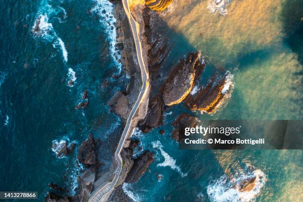 overhead view of stone bridge over the ocean. basque country, spain - spanish basque country ストックフォトと画像