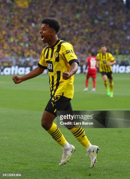Karim Adeyemi of Borussia Dortmund celebrates after Marco Reus scores their side's first goal during the Bundesliga match between Borussia Dortmund...