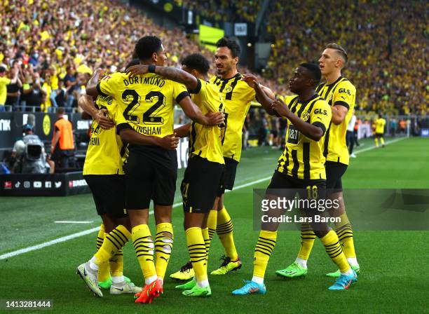 Karim Adeyemi of Borussia Dortmund celebrates with teammates after Marco Reus scores their side's first goal during the Bundesliga match between...