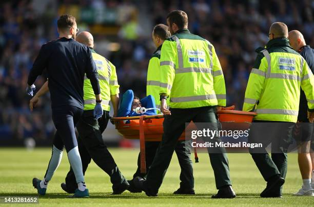 Ben Godfrey of Everton is stretchered off the pitch after receiving medical treatment during the Premier League match between Everton FC and Chelsea...