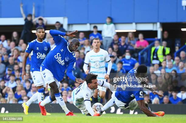 Ben Chilwell of Chelsea is brought down in the box after being challenged by Abdoulaye Doucoure of Everton during the Premier League match between...