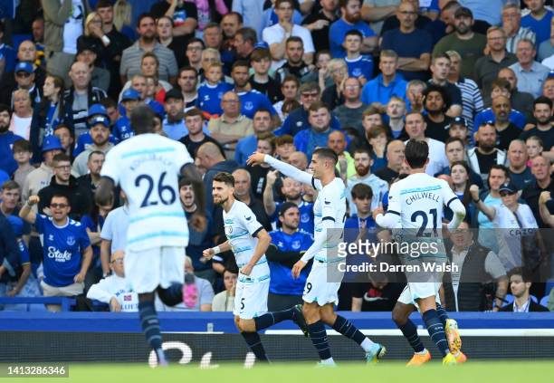 Jorginho of Chelsea celebrates scoring their side's first goal from a penalty with teammates during the Premier League match between Everton FC and...