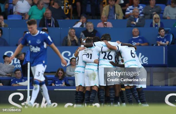 Jorginho of Chelsea celebrates scoring their side's first goal from a penalty with teammates during the Premier League match between Everton FC and...