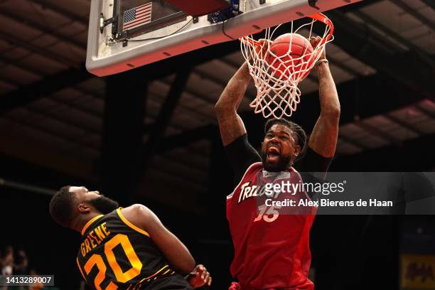 Amir Johnson of the Trilogy dunks against Donte Green of the Killer 3's during BIG3 Week Eight at Comerica Center on August 06, 2022 in Frisco, Texas.