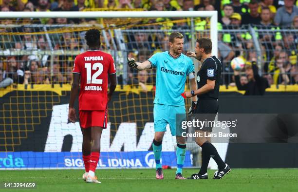 Lukas Hradecky of Bayer Leverkusen receives a red card from Referee Felix Brych during the Bundesliga match between Borussia Dortmund and Bayer 04...