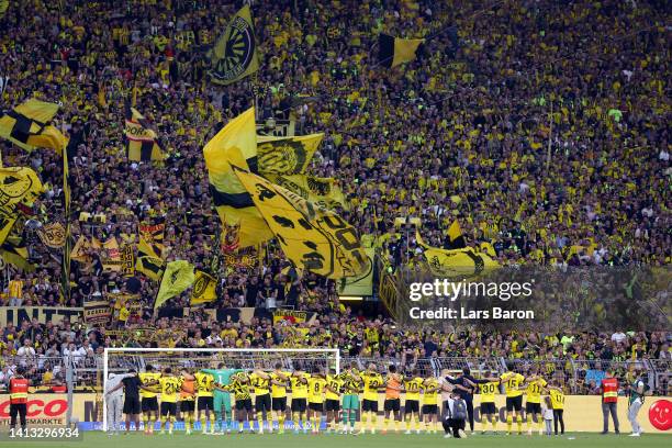 General view as the players of Borussia Dortmund line up in front of theirs fans after the final whistle of the Bundesliga match between Borussia...
