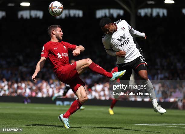 James Milner of Liverpool battles with Kenny Tete of Fulham during the Premier League match between Fulham FC and Liverpool FC at Craven Cottage on...