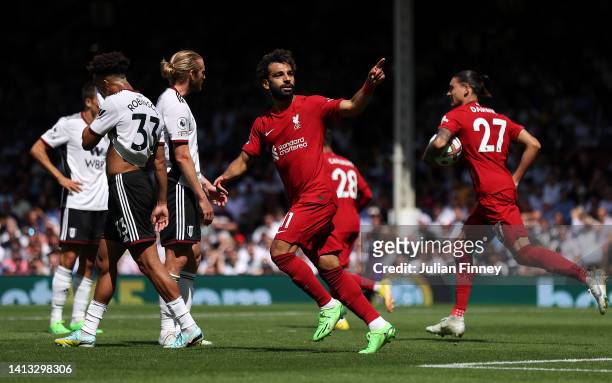 Mohamed Salah of Liverpool celebrates scoring their side's second goal during the Premier League match between Fulham FC and Liverpool FC at Craven...