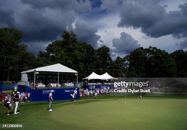 Will Zalatoris of the United States chips on the 17th green during the third round of the Wyndham Championship at Sedgefield Country Club on August...