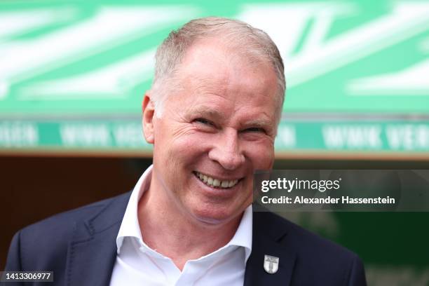 Stefan Reuter, Sporting director of Augsburg smiles prior to the Bundesliga match between FC Augsburg and Sport-Club Freiburg at WWK-Arena on August...