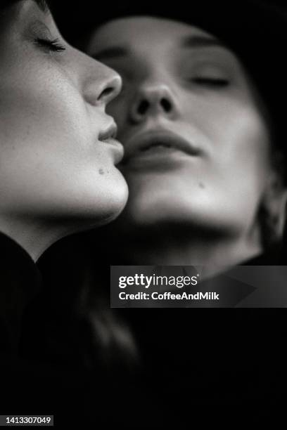 beautiful woman and her reflection - close up of beautiful young blonde woman with black hat stock pictures, royalty-free photos & images