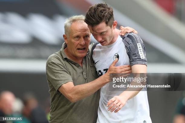 Christian Streich, head coach of Freiburg reacts with his player Michael Gregoritsch during the Bundesliga match between FC Augsburg and Sport-Club...