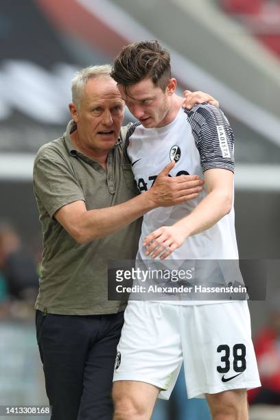 Christian Streich, head coach of Freiburg reacts with his player Michael Gregoritsch during the Bundesliga match between FC Augsburg and Sport-Club...