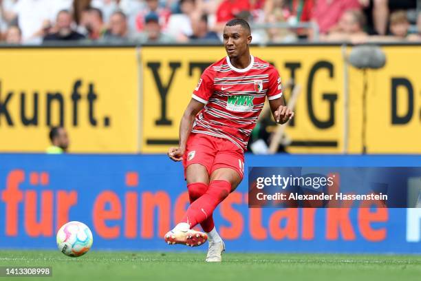 Ohis Felix Udoukhai of Augsburg runs with the ball during the Bundesliga match between FC Augsburg and Sport-Club Freiburg at WWK-Arena on August 06,...