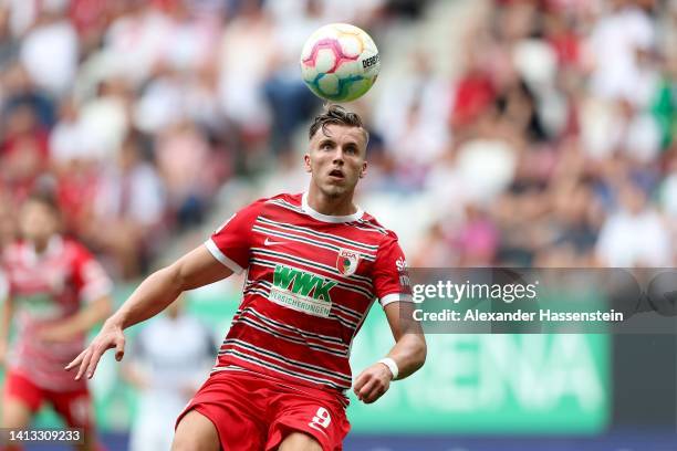Ermedin Demirovic of Augsburg runs with the ball during the Bundesliga match between FC Augsburg and Sport-Club Freiburg at WWK-Arena on August 06,...