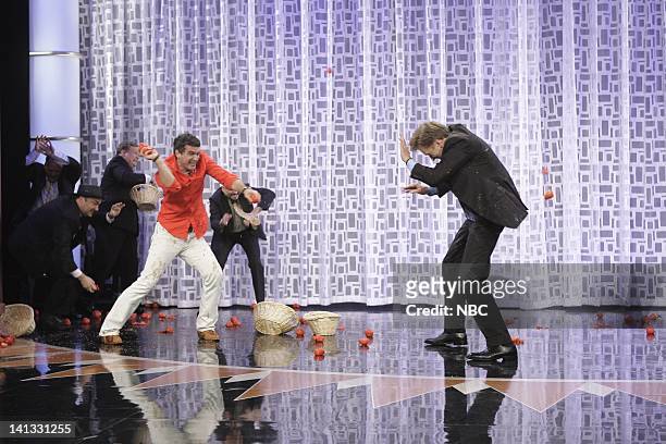 Air Date -- Episode 64 -- Pictured: Actor Antonio Banderas and host Conan O'Brien throw Tomatoes at each other during a segment on September 11, 2009...