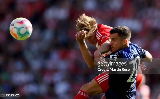 Kevin Behrens of 1. FC Union Berlin challenges Marc Oliver Kempf of Hertha BSC looks on during the Bundesliga match between 1. FC Union Berlin and...