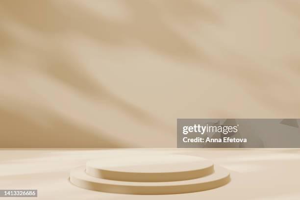 beige podium on background with natural shadows. perfect platform for your product. - coloured light patterns in a studio environment stock pictures, royalty-free photos & images