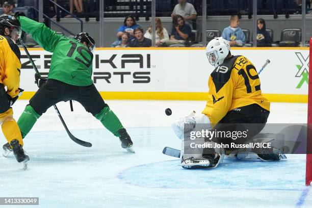 Chris Mueller of Team Murphy deflects the puck against Jacob Theut of Team Mullen during 3ICE Week Eight at Bridgestone Arena on August 06, 2022 in...