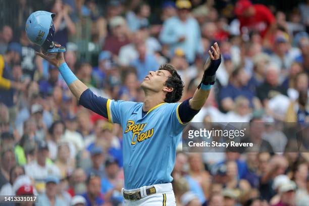 Christian Yelich of the Milwaukee Brewers reacts to the instant replay call of his stolen base attempt at third base during the first inning against...