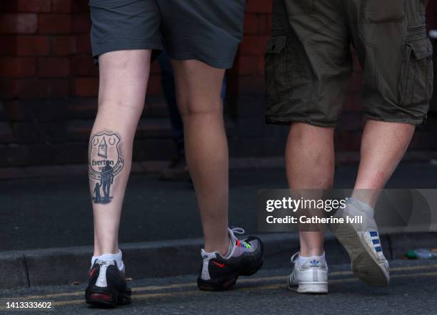 An Everton fan with a tattoo on his leg ahead of the Premier League match between Everton FC and Chelsea FC at Goodison Park on August 06, 2022 in...