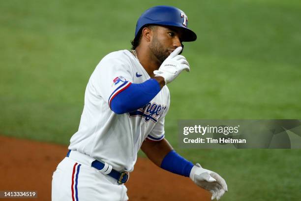 Ezequiel Duran of the Texas Rangers rounds the bases after hitting a home run against the Chicago White Sox in the third inning at Globe Life Field...