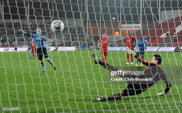 Davy Klaassen of Ajax scores his side's fourth goal from the penalty spot past Danny Ward of Liverpool during the NextGen Series Semi-Final match...