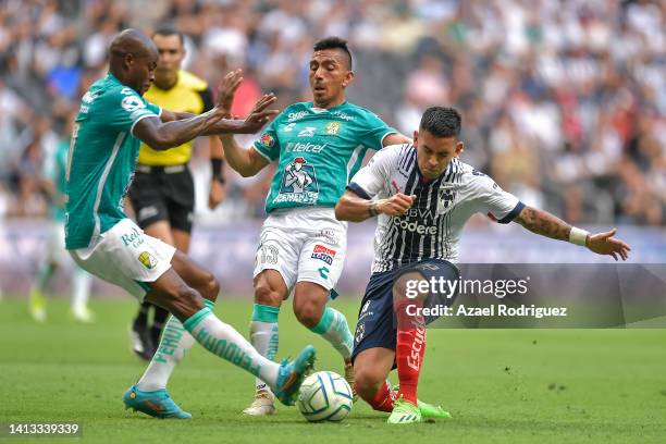 Sebastián Vegas of Monterrey fights for the ball with Joel Campbell and Ángel Mena of León during the 7th round match between Monterrey and Leon as...