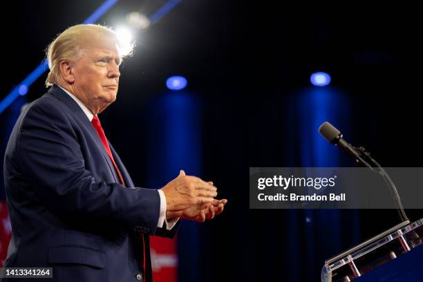 Former U.S. President Donald Trump applauds upon arrival at the Conservative Political Action Conference at the Hilton Anatole on August 06, 2022 in...