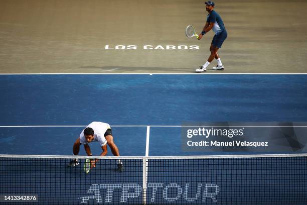Marcelo Melo of Brazil and Raven Klaasen of South Africa serves against William Blumberg of the United States and Miomir Kecmanovic of Serbia during...