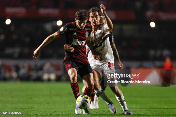 Ayrton Lucas of Flamengo fights for the ball with Igor Gomes of Sao Paulo during the match between Sao Paulo and Flamengo as part of Brasileirao...