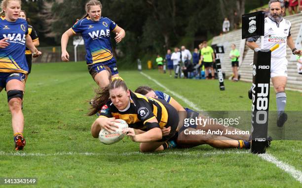Paige Neilson of Taranaki scores a try during the round four Farah Palmer Cup match between Taranaki and Otago at New Plymouth Gully Ground, on...