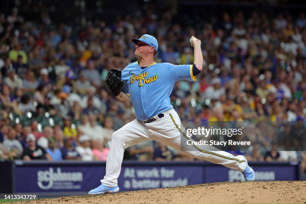 Jake McGee of the Milwaukee Brewers throws a pitch during the seventh inning against the Cincinnati Reds at American Family Field on August 06, 2022...