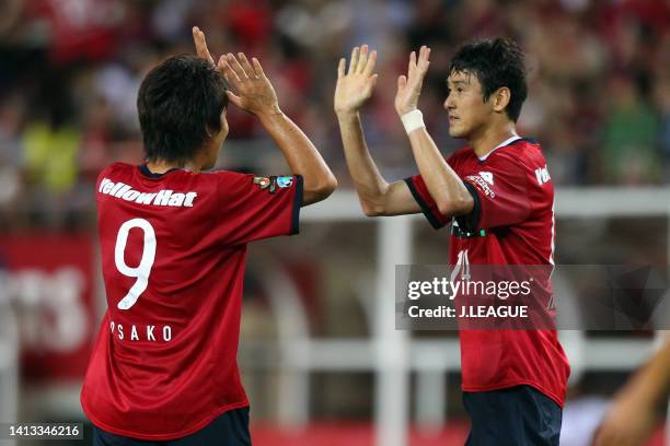 Lee Jung-soo of Kashima Antlers celebrates scoring his side's second goal with his teammate Yuya Osako during the J.League J1 match between Kashima...