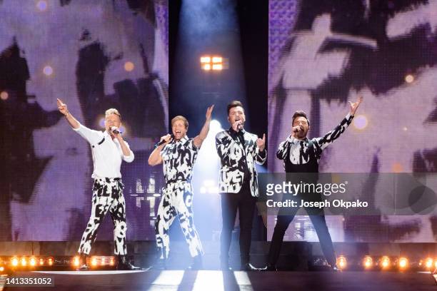 Nicky Byrne, Kian Egan, Markus Feehily and Shane Filan Westlife Perform at Wembley Stadium on August 06, 2022 in London, England.