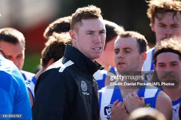 Kangaroos head coach Tom Lynch speaks to his players during the round 20 VFL match between North Melbourne Kangaroos and Sydney Swans at Arden Street...