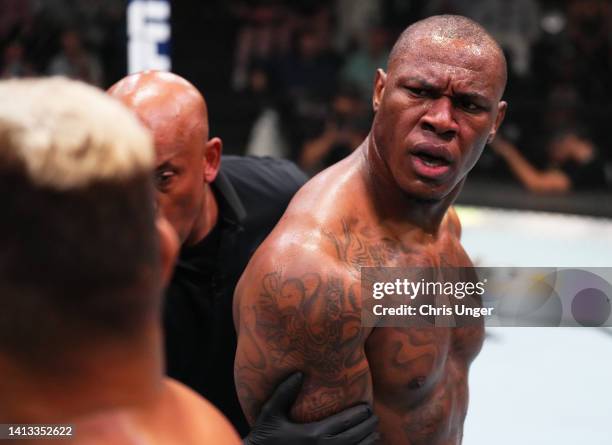 Mohammed Usman of Nigeria has words with Zac Pauga after the first round of their heavyweight fight during the UFC Fight Night event at UFC APEX on...