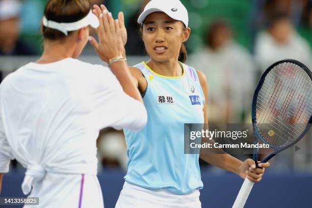 Veronika Kudermetova of Russia and Zhang Shuai of China high five during the Semi- Final doubles match against Yang Zhaoxuan of China and Xu Yifan of...