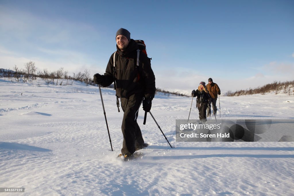 Cross-country skiers walking in snow