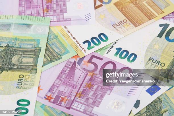 euro banknotes as a background - euro schein stock-fotos und bilder